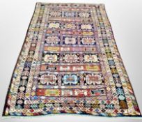 A Caucasian rug with a dense polychrome compartmentalised field,