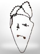 A costume necklace and two pairs of earrings