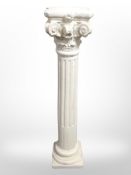 A plaster classical style pedestal,