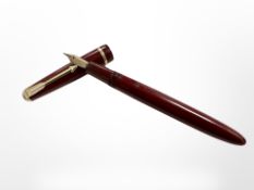 A Parker Slimfold fountain pen in Burgundy case with 14ct gold nib.