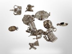 Eleven silver charms