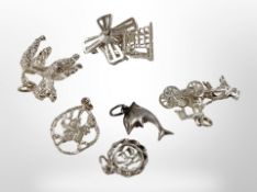 Six silver charms