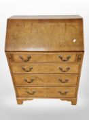 A George III style walnut bureau,