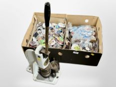 A Universal Button Badger badge making press and box of pin badges