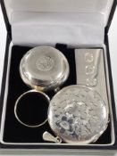 A silver sovereign holder,