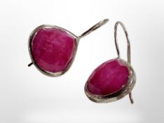 A pair of silver earrings