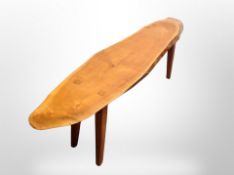 A rustic plank topped bench,