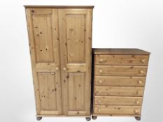 A contemporary pine double door wardrobe,