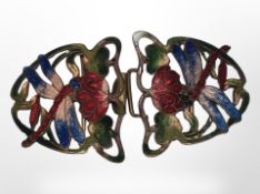 An enamelled brass belt buckle depicting dragonflies,