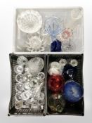 Three crates of 20th century clear and coloured glass ware, vases,