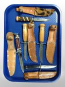 Five Scandinavian hunting knives in leather sheaths