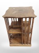 An Edwardian oak revolving book table,