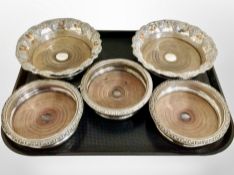 A pair of silver plate on copper bottle coasters embossed with grapes, diameter 20 cm,