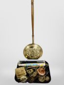 A brass bed warming pan together with a group of horse brasses, chestnut roaster, magnifying glass,