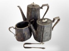 A Victorian silver plated three piece tea service and further pair of tongs