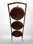 An Edwardian oak three tier cake stand