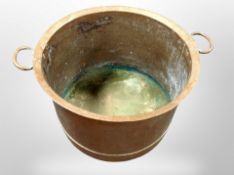 A 19th century copper twin handled cooking pot,