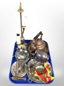 A group of metal wares, copper kettle, ornate brass lamp base, pewter chamber stick,