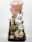 A box of contemporary table lamp bases and shades.