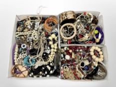 Three boxes of assorted costume jewellery, bangles, bead necklaces, etc.