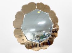 An Art Deco two-tone peach glass frameless mirror,