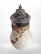 A silver-mounted ceramic sugar caster.