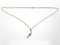 A silver peacock pendant on silver chain
