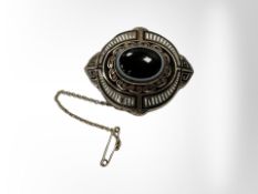 A Victorian memorial brooch with enamel decoration.