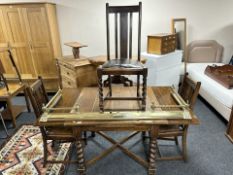 An Edwardian oak barley twist pull-out dining table,