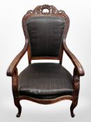 A pair of continental carved beech armchairs