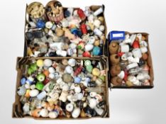 Three boxes containing a large quantity of ceramic salt and pepper sifters, bottles, etc.