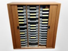 A 20th century Danish teak shutter front office cabinet,