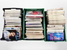 Three crates containing vintage Vogue magazines