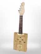 A homemade cigar box guitar.