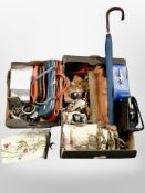 Two boxes containing lady's handbags, sunglasses, embroidered church pull cord, costume jewellery.