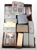 A box of scented candle gift sets.