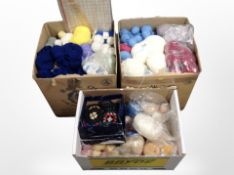 Three boxes containing a large quantity of wool.