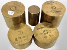 A group of five trench art weights.