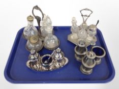 Four silver-plated cruet sets.
