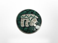 A heavy silver brooch