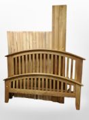 A contemporary oak 4'6 bed frame