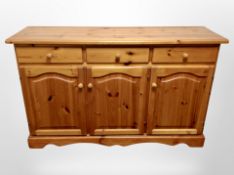 A contemporary pine sideboard,