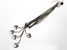 A five-strand pull-through silver bracelet.