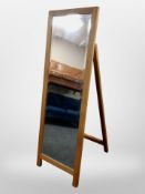 A contemporary oak easel mirror,