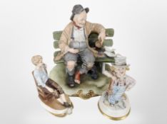 Three Capodimonte figures.