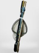 A bundle of fishing rods, landing net.