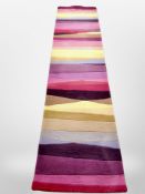 A contemporary machine made striped runner,