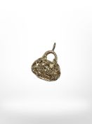 A silver hand bag pendant