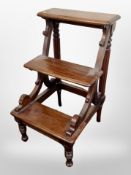 A reproduction mahogany library step,