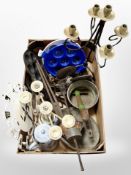 A box of antique metal wares including wrought iron candle stand, cooking pans, etc.